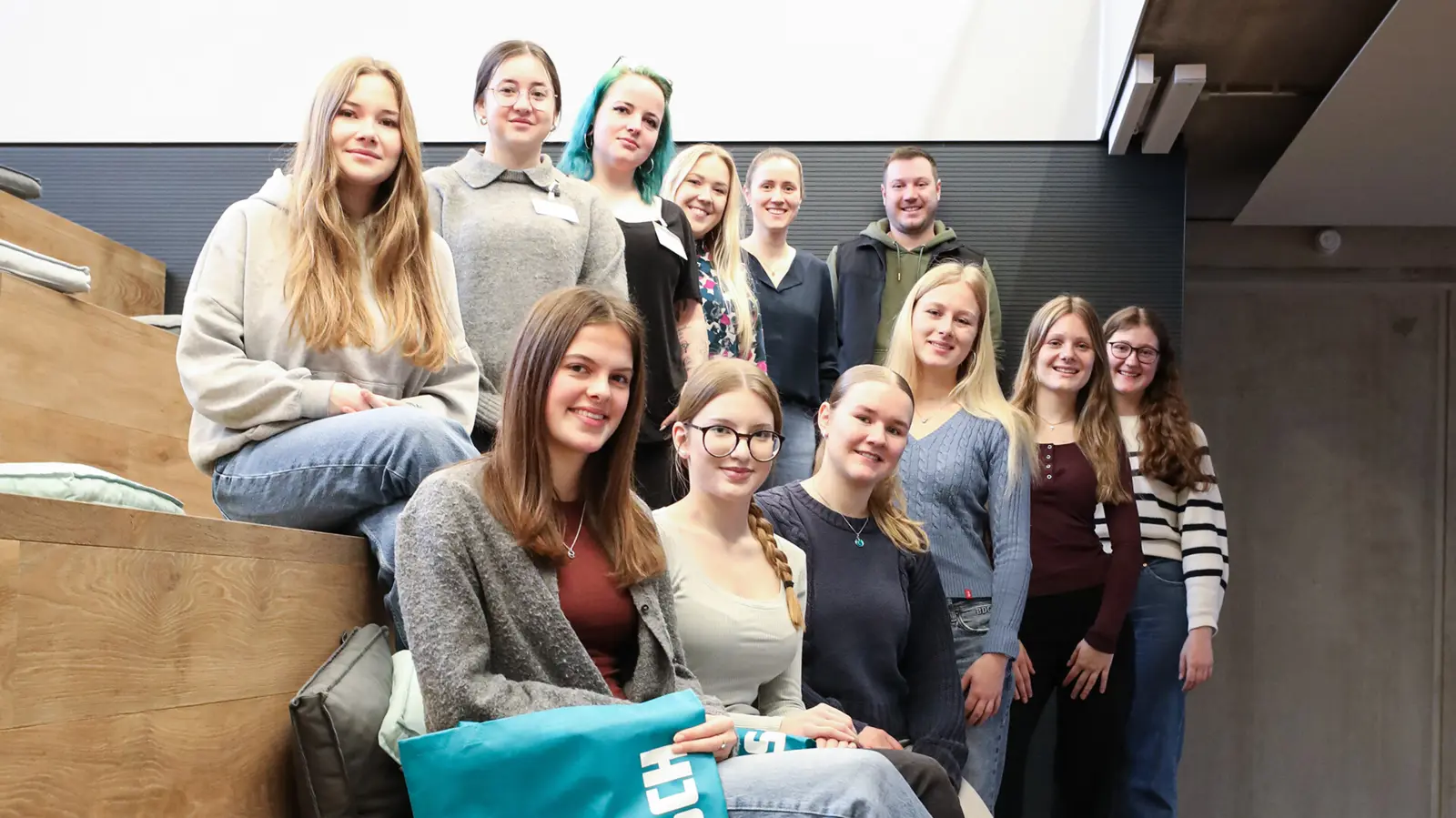 Young women participating in the MINT@Work initiative at NETZSCH, engaging in technology-oriented discussions and activities.