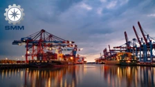 Vibrant scene of cargo ships and cranes at the SMM maritime trade fair in Hamburg, showcasing the bustling maritime industry.